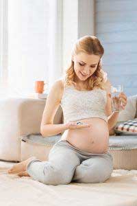 pregnant woman sitting on the floor