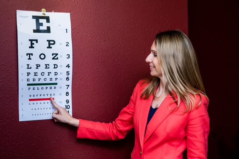 GetzWell Pediatrician Group In San Francisco California GetzWell pediatrician Nicole Glynn, MD pointing to a line on an eye chart at one of GetzWell's two San Francisco locations.